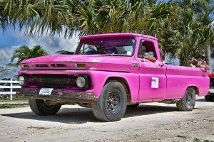 A pink old pick-up truck