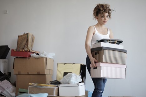 A woman decluttering.