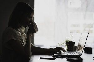 Woman looking at her laptop